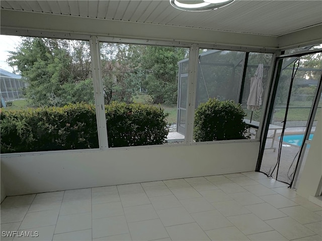 unfurnished sunroom featuring a healthy amount of sunlight