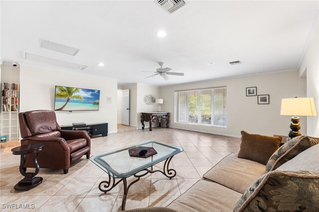 living room featuring ornamental molding, light tile patterned floors, and ceiling fan