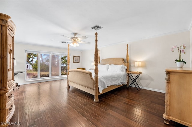 bedroom featuring dark hardwood / wood-style flooring, crown molding, and ceiling fan