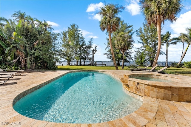 view of pool with an in ground hot tub and a patio area