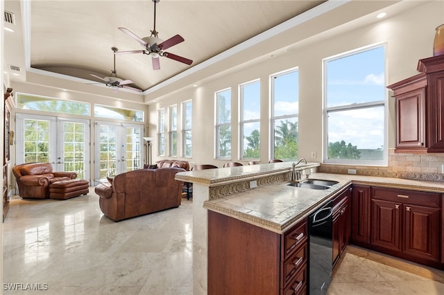 kitchen featuring dishwasher, lofted ceiling, sink, backsplash, and kitchen peninsula