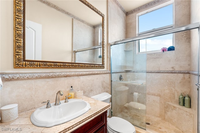 bathroom featuring vanity, tile walls, an enclosed shower, and toilet