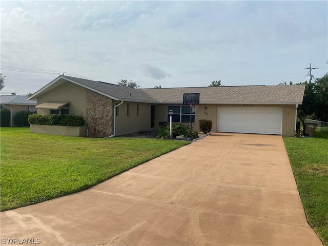 single story home featuring a garage, driveway, a front yard, and stucco siding