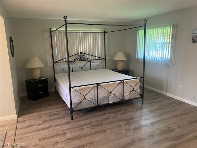 bedroom featuring wood-type flooring