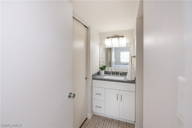 bathroom featuring tile patterned flooring and vanity