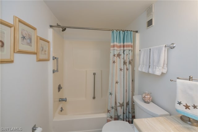 bathroom with shower / bath combination with curtain and toilet