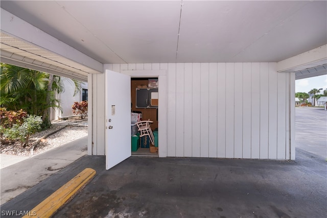 garage featuring wood walls