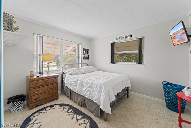 bedroom featuring crown molding