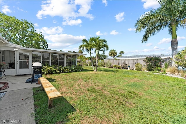 view of yard with a sunroom