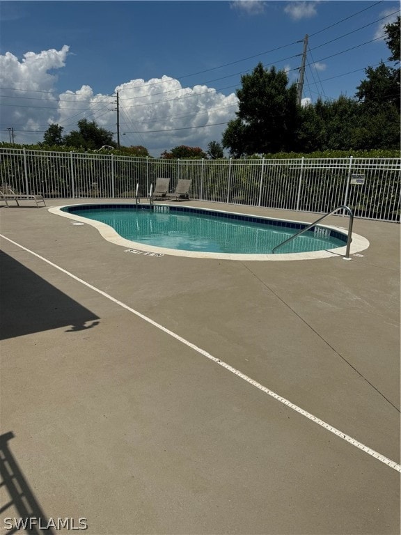 view of swimming pool featuring a patio