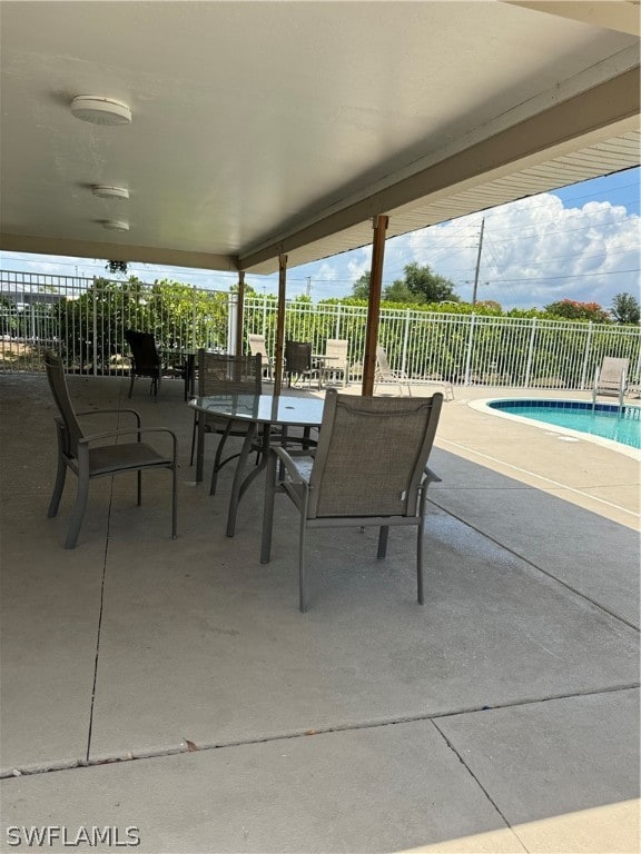 view of patio / terrace featuring a fenced in pool