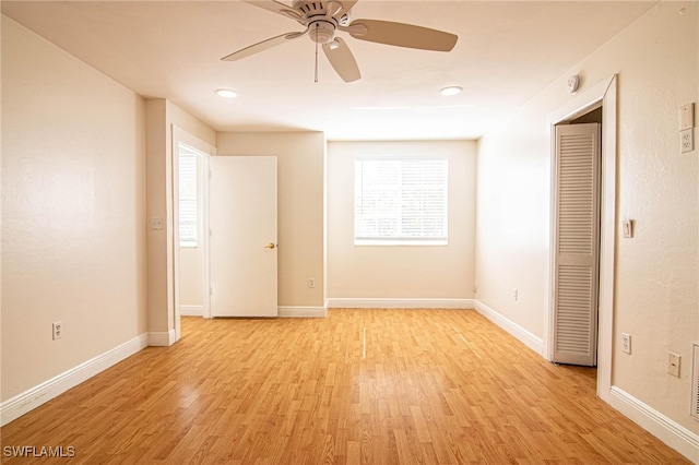 empty room featuring light hardwood / wood-style floors and ceiling fan