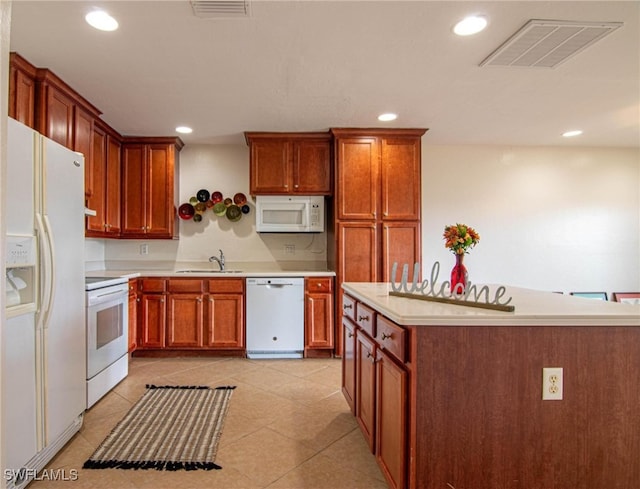 kitchen featuring sink and white appliances