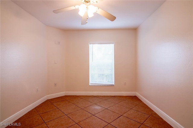 tiled empty room with ceiling fan