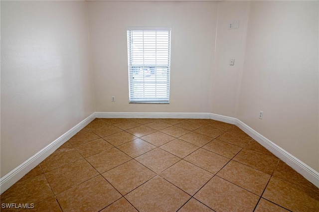 spare room featuring tile patterned floors