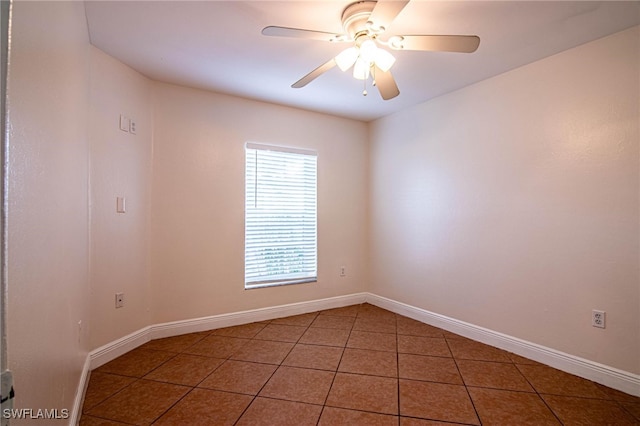 tiled empty room with ceiling fan