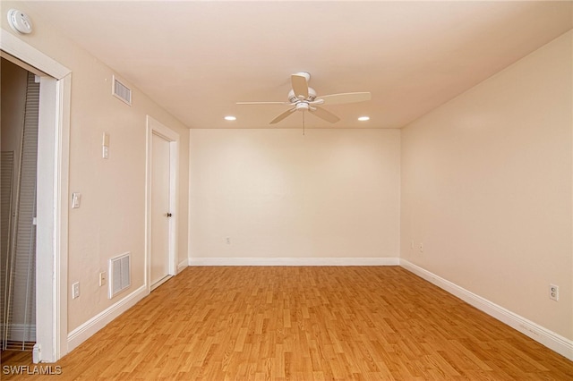 spare room with ceiling fan and light hardwood / wood-style flooring