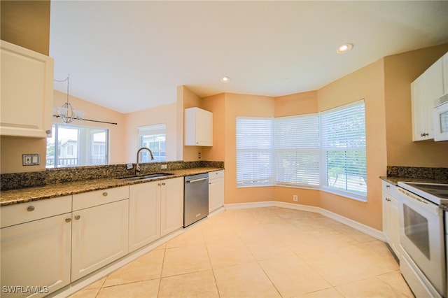 kitchen with white cabinets, white appliances, and sink