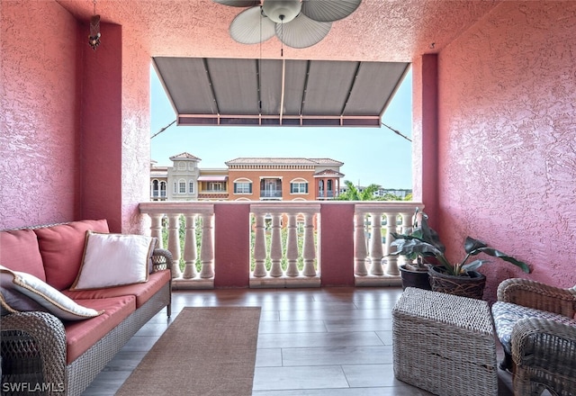 balcony featuring ceiling fan