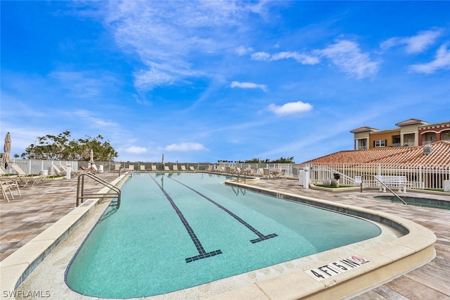 view of pool featuring a patio