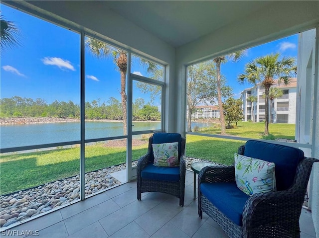 sunroom / solarium with a water view and a healthy amount of sunlight