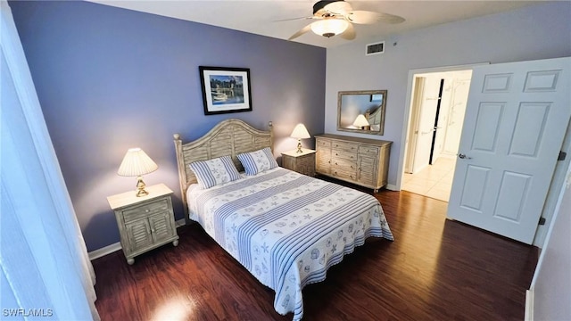 bedroom with dark hardwood / wood-style floors and ceiling fan