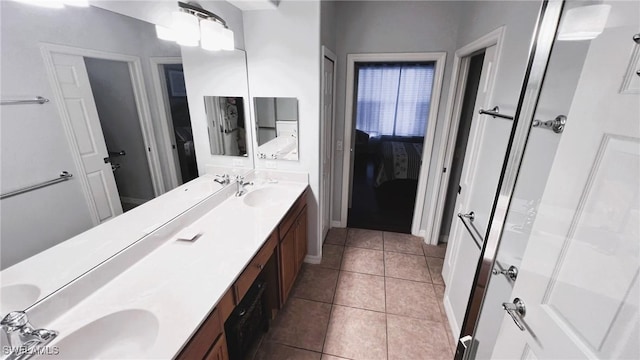 bathroom featuring tile patterned flooring and vanity