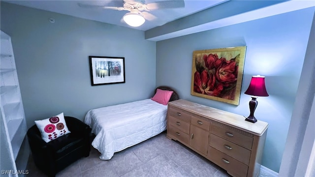 tiled bedroom with ceiling fan