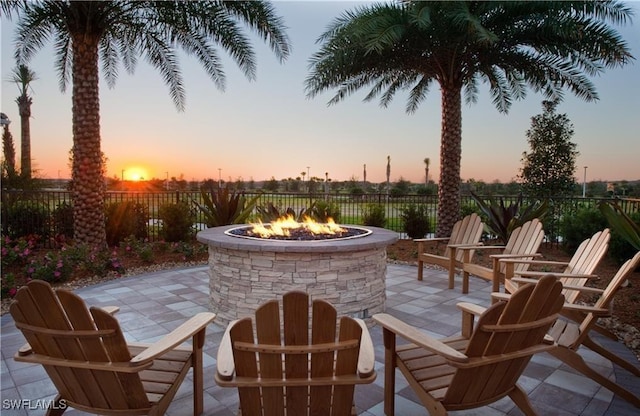 patio terrace at dusk with a fire pit