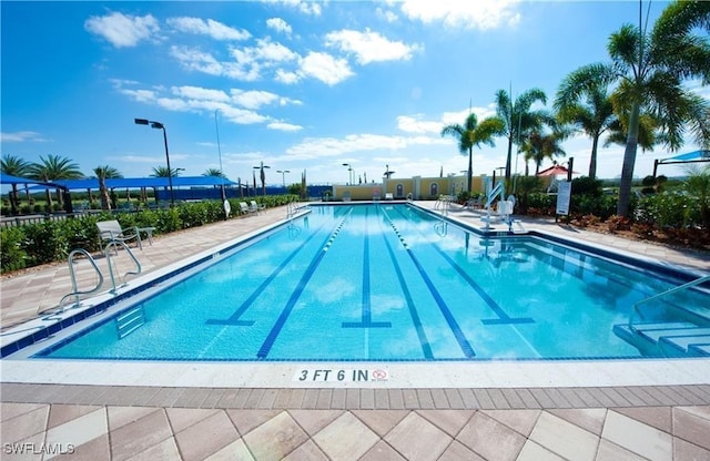 view of swimming pool featuring a patio