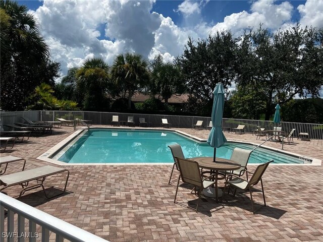 view of swimming pool featuring a patio area