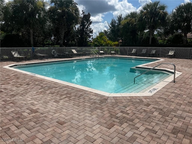 view of swimming pool with a patio area