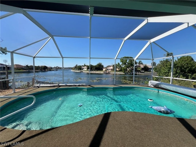 view of pool with a water view and a lanai