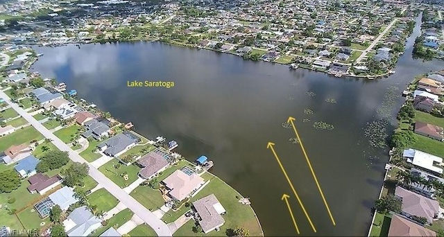 birds eye view of property with a water view