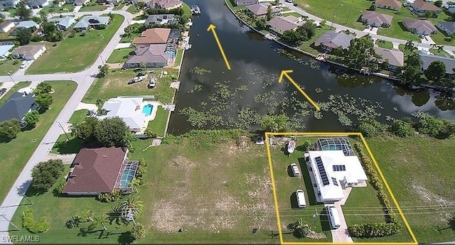 birds eye view of property featuring a water view