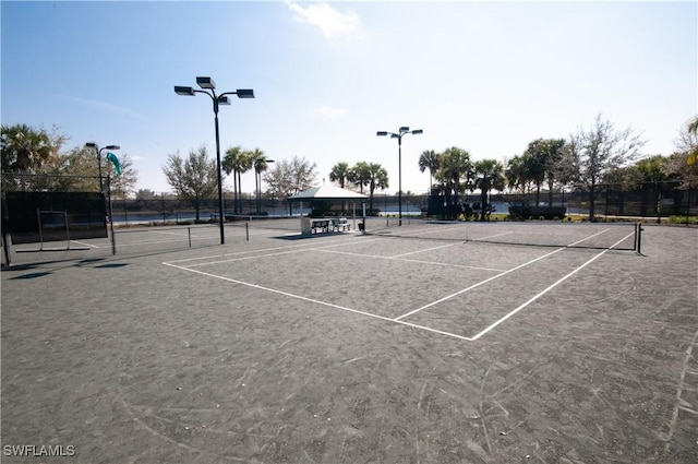 7804 Umberto Ct, Naples, FL 34114 - view of tennis court featuring community basketball court and fence