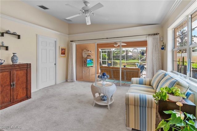 interior space featuring light carpet, ornamental molding, and a wealth of natural light