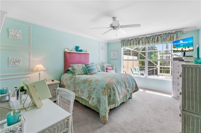 carpeted bedroom with crown molding and ceiling fan