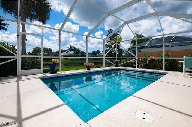 7804 Umberto Ct, Naples, FL 34114 - outdoor pool featuring glass enclosure and a patio