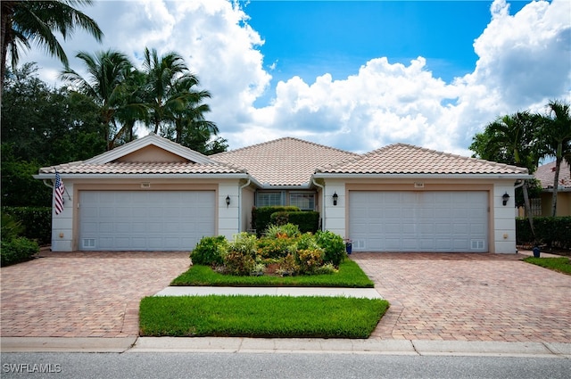 view of front of property with a garage