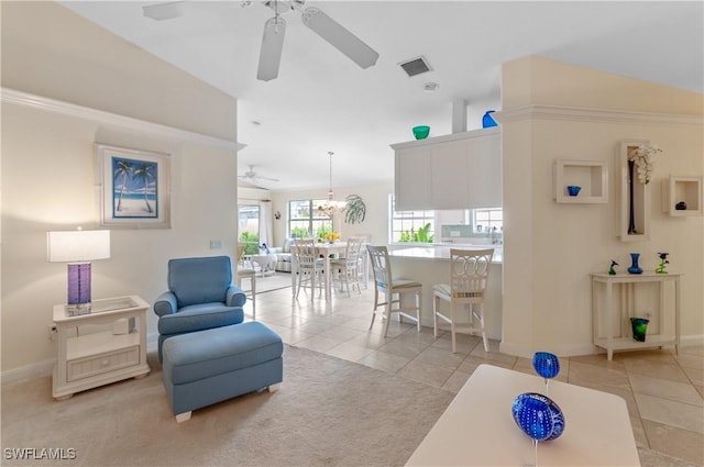 7804 Umberto Ct, Naples, FL 34114 - living area featuring light tile patterned floors, visible vents, baseboards, and ceiling fan with notable chandelier