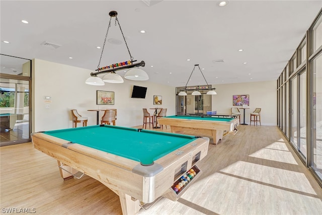 playroom with light wood-type flooring and billiards