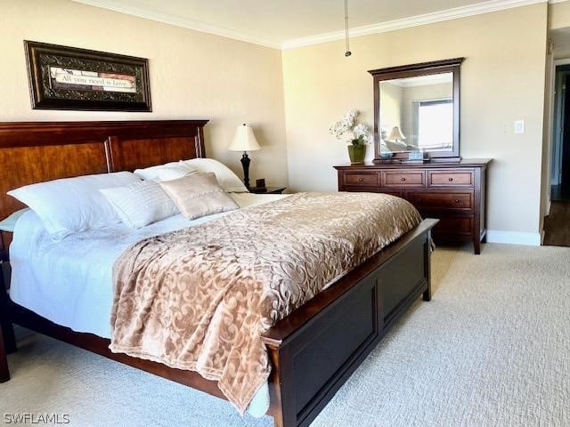 bedroom featuring light carpet and ornamental molding