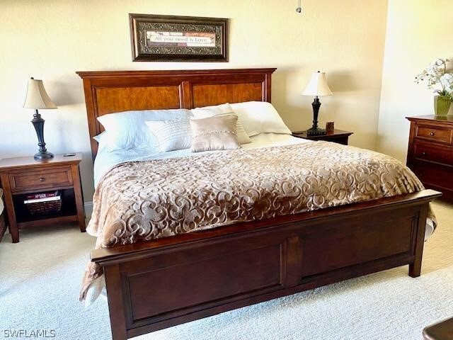 bedroom with light carpet