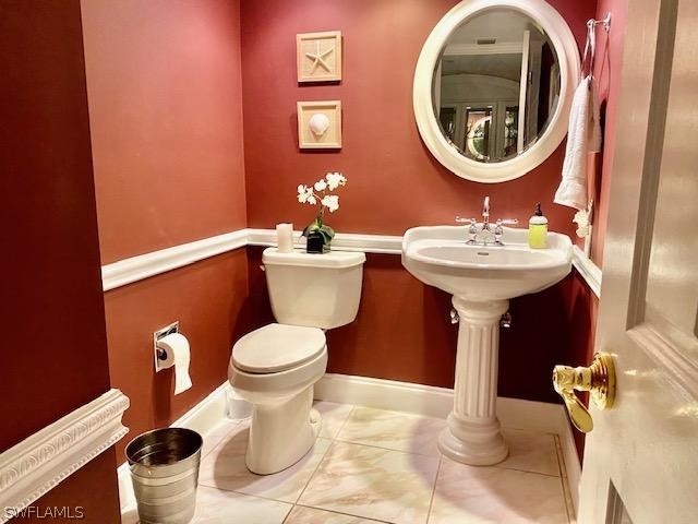 bathroom featuring tile patterned floors and toilet