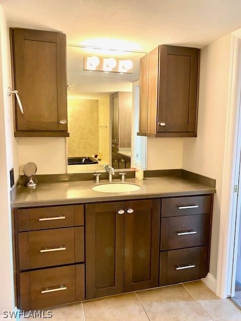 bathroom with vanity and tile patterned floors