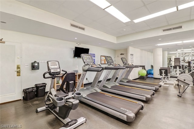 gym featuring a drop ceiling and visible vents