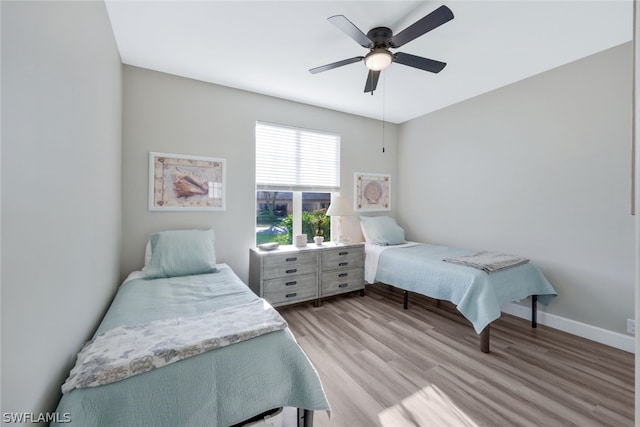 bedroom featuring light hardwood / wood-style floors and ceiling fan