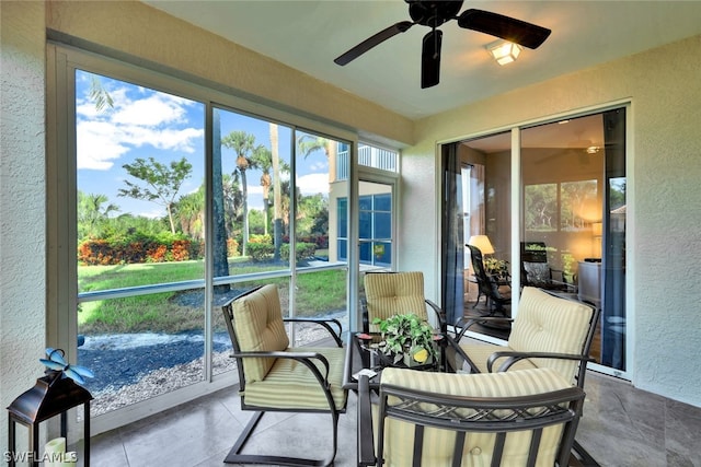 sunroom / solarium with ceiling fan