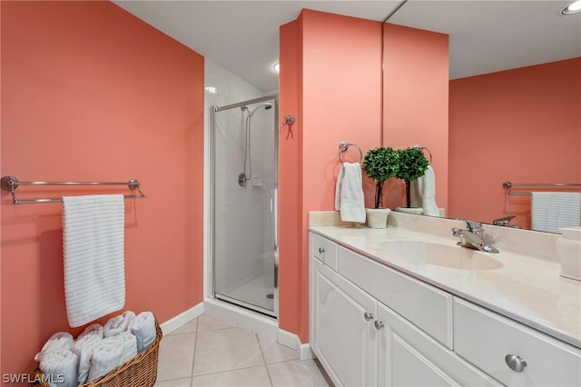 bathroom featuring vanity, tile patterned flooring, and a shower with shower door